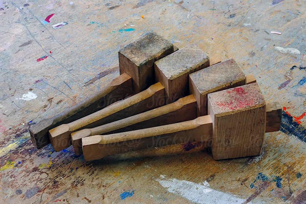 Wooden mallets used in a classroom for art and design. Placed on a school table