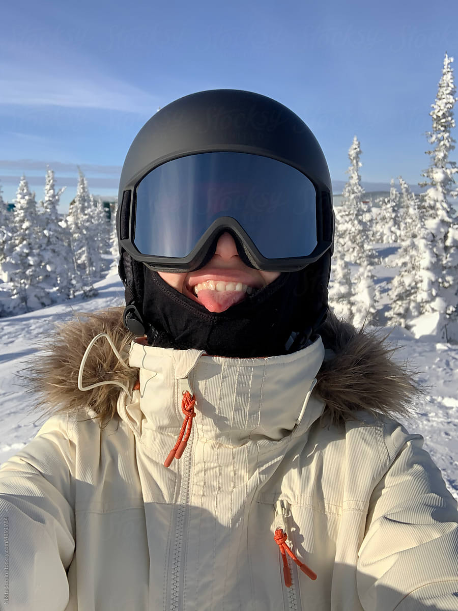 Woman skiing and taking a selfie