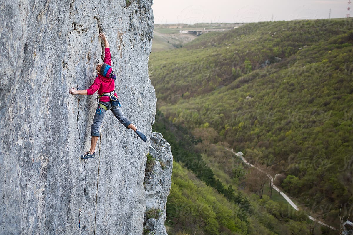 Young man rock climbing outdoor