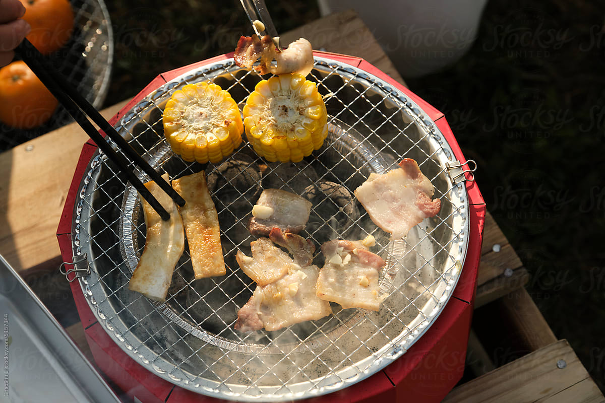 Closeup of a small oven grilling outdoors