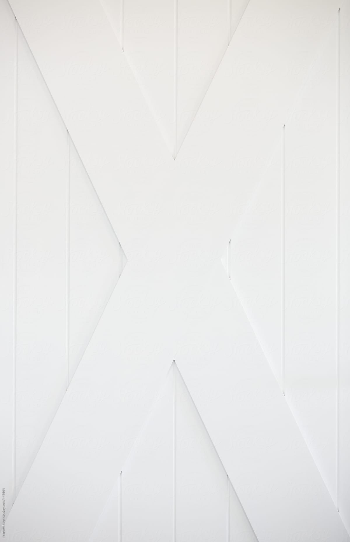 Background image of a white X on door frame
