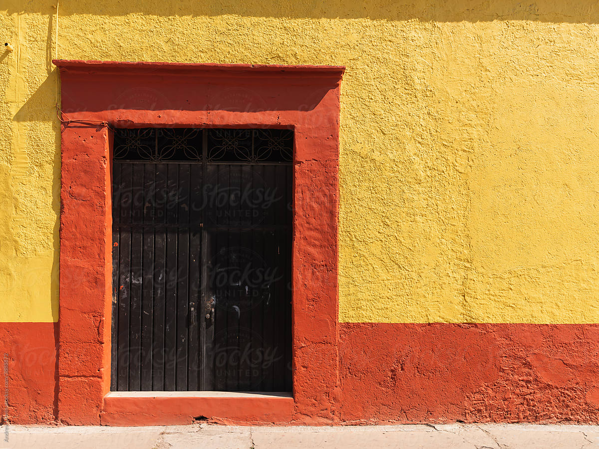 A yellow and red house in Mexico