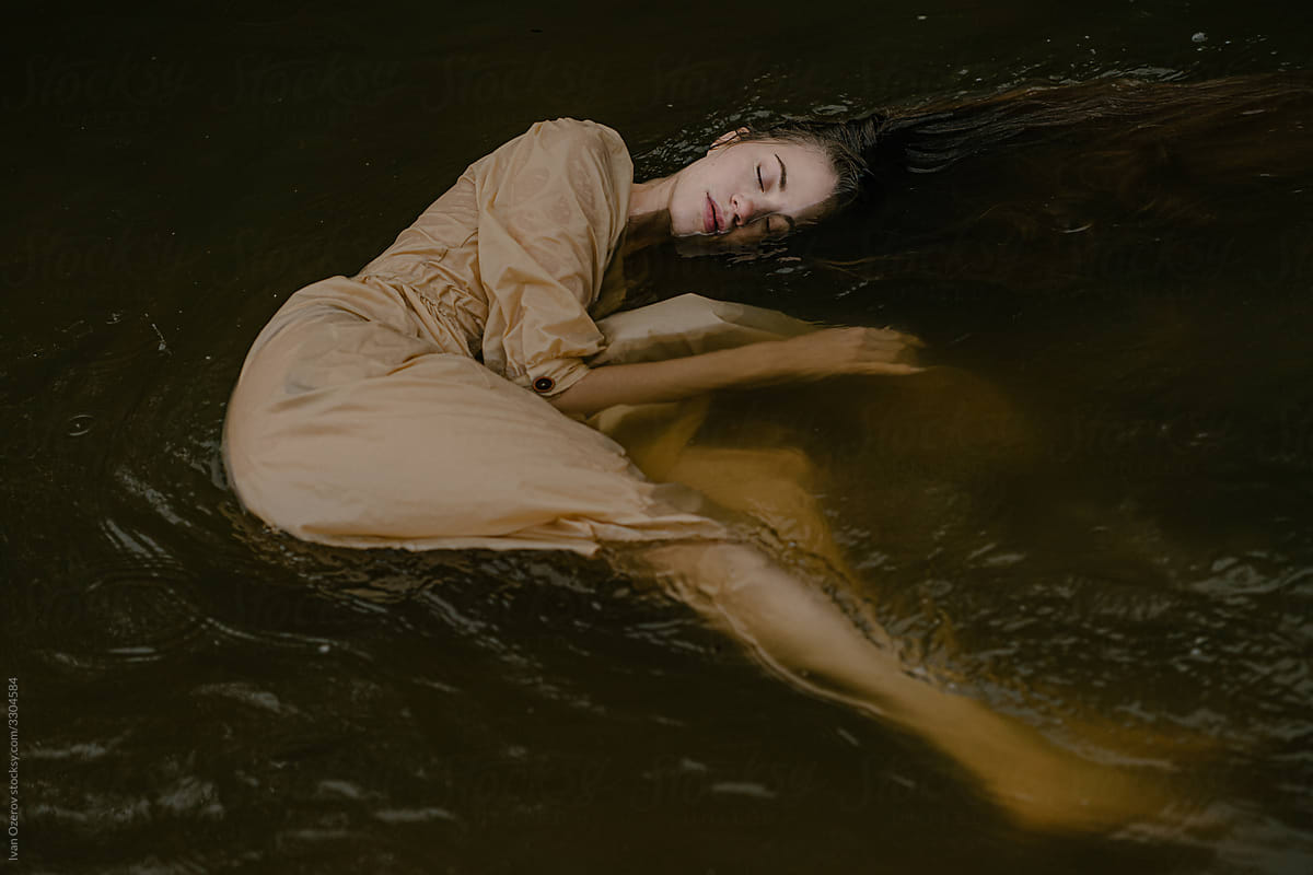 Woman Dreaming In A River