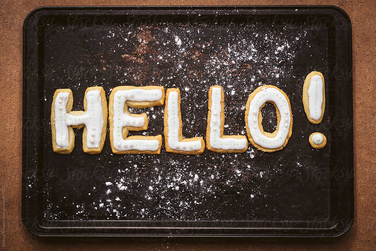 Cookies spelling out hello on a baking tray