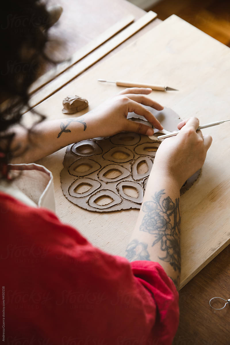 Woman making ceramic earrings