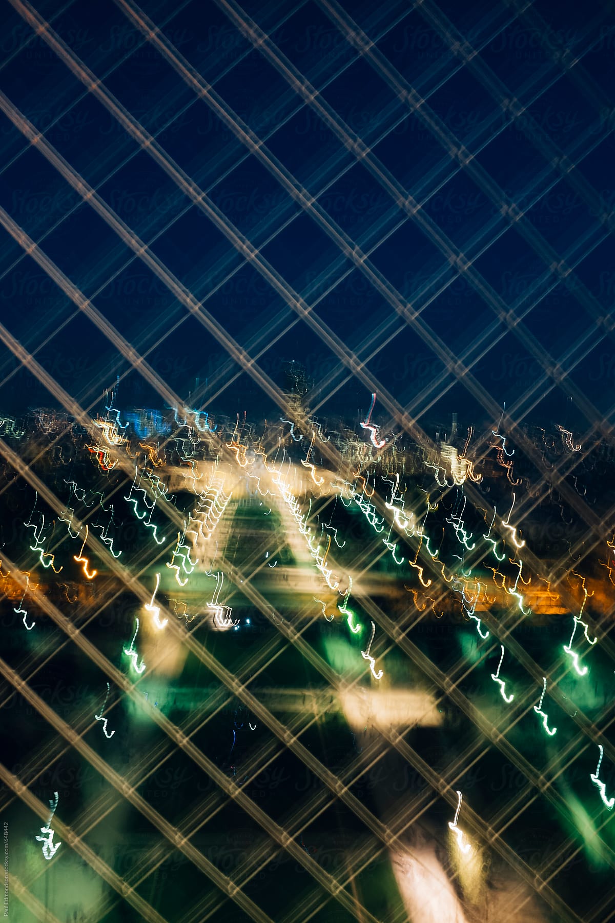 Blurred view of Paris skyline at night, from the Eiffel Tower