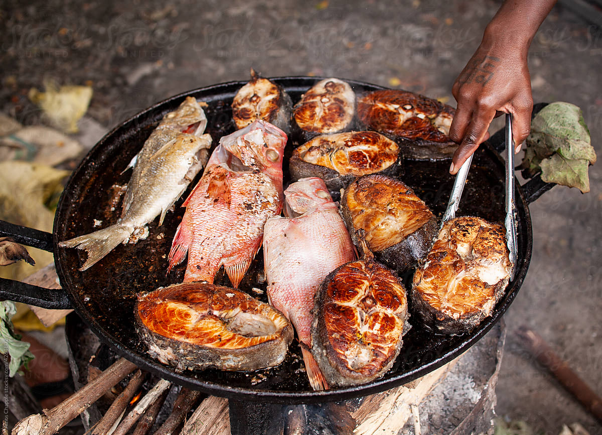 Fish being cooked on a griddle