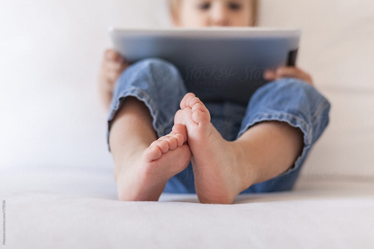 Little Boy Watching Cartoon on a Tablet Computer