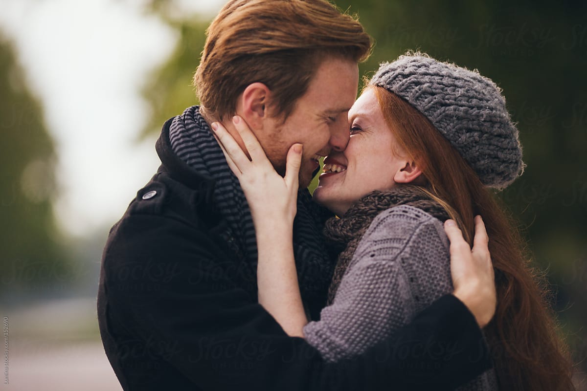 Red-Haired Couple Kissing
