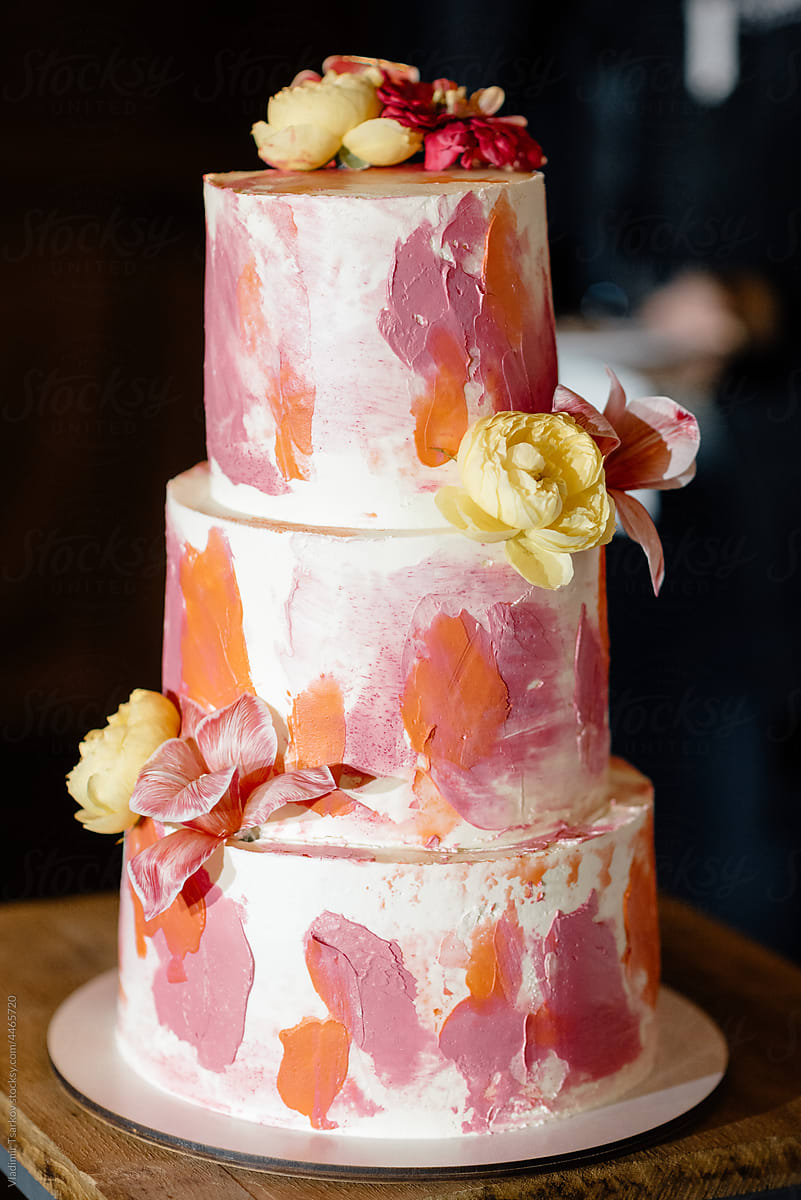 layered cream cake with abstract decoration