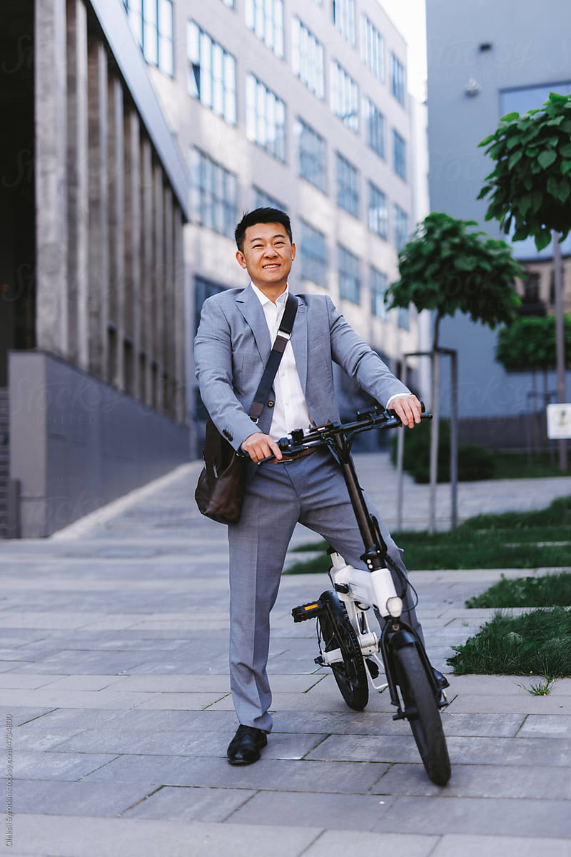 Businessman on electric bicycle outdoor