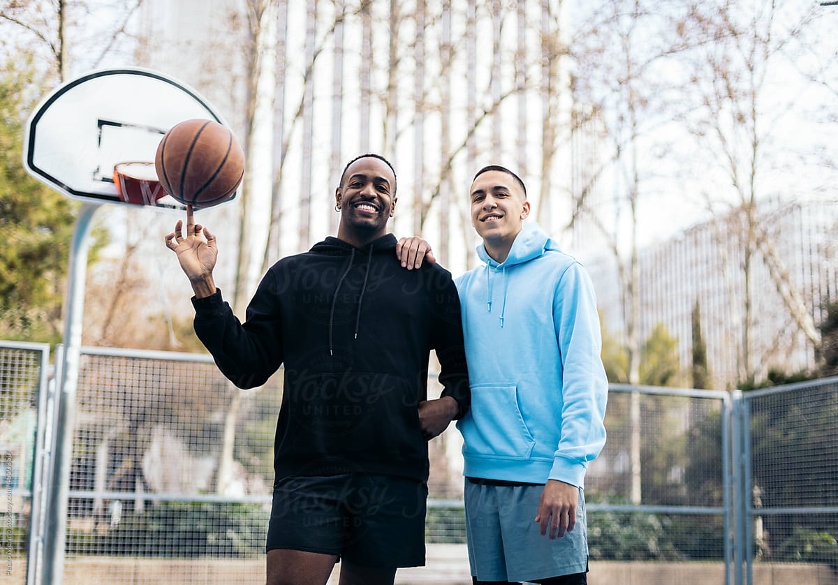 Basketball players on an outdoor court