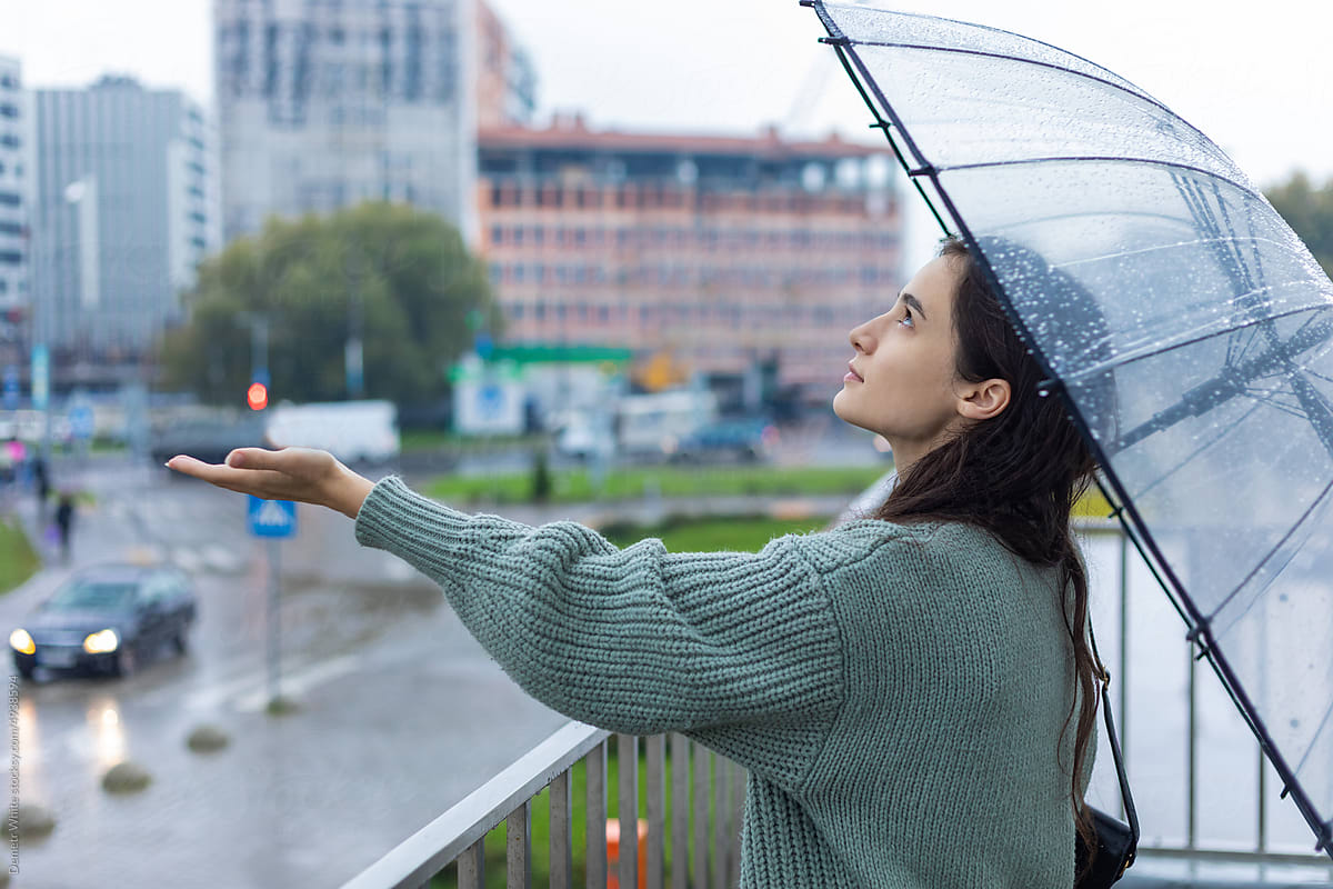 girl catching rain with her hands