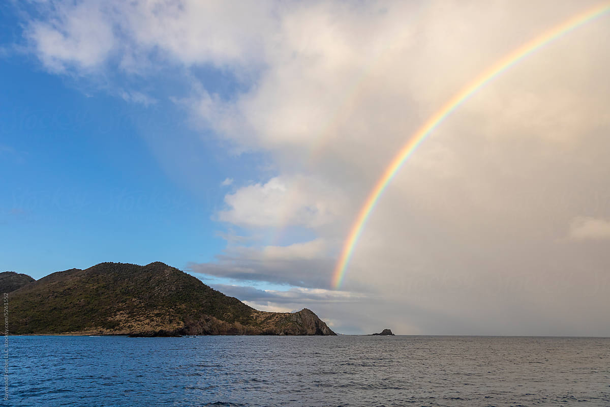 Beautiful nature landscape rainbow off coast of island Caribbean