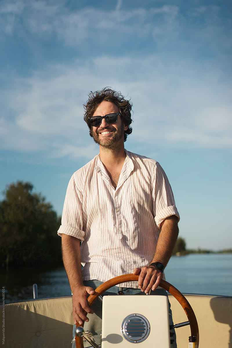 Happy man boating on summer