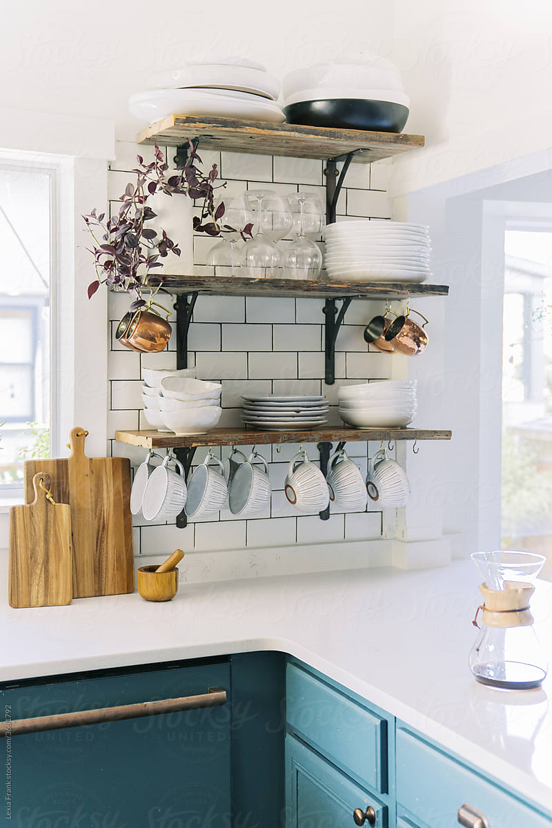 open shelving in kitchen and coffee on counter