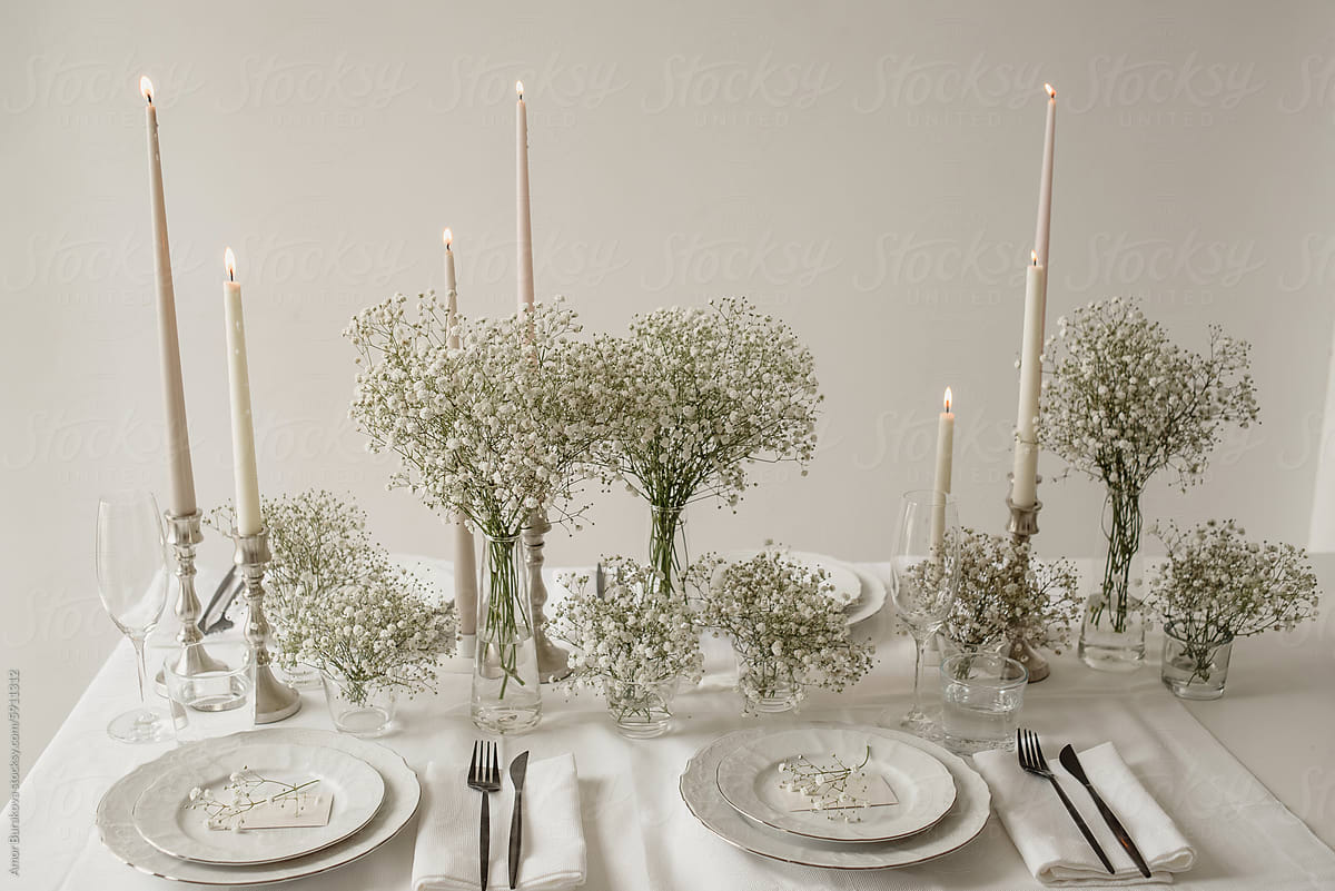 A Table Set for a Formal Dinner With Flowers and Candles