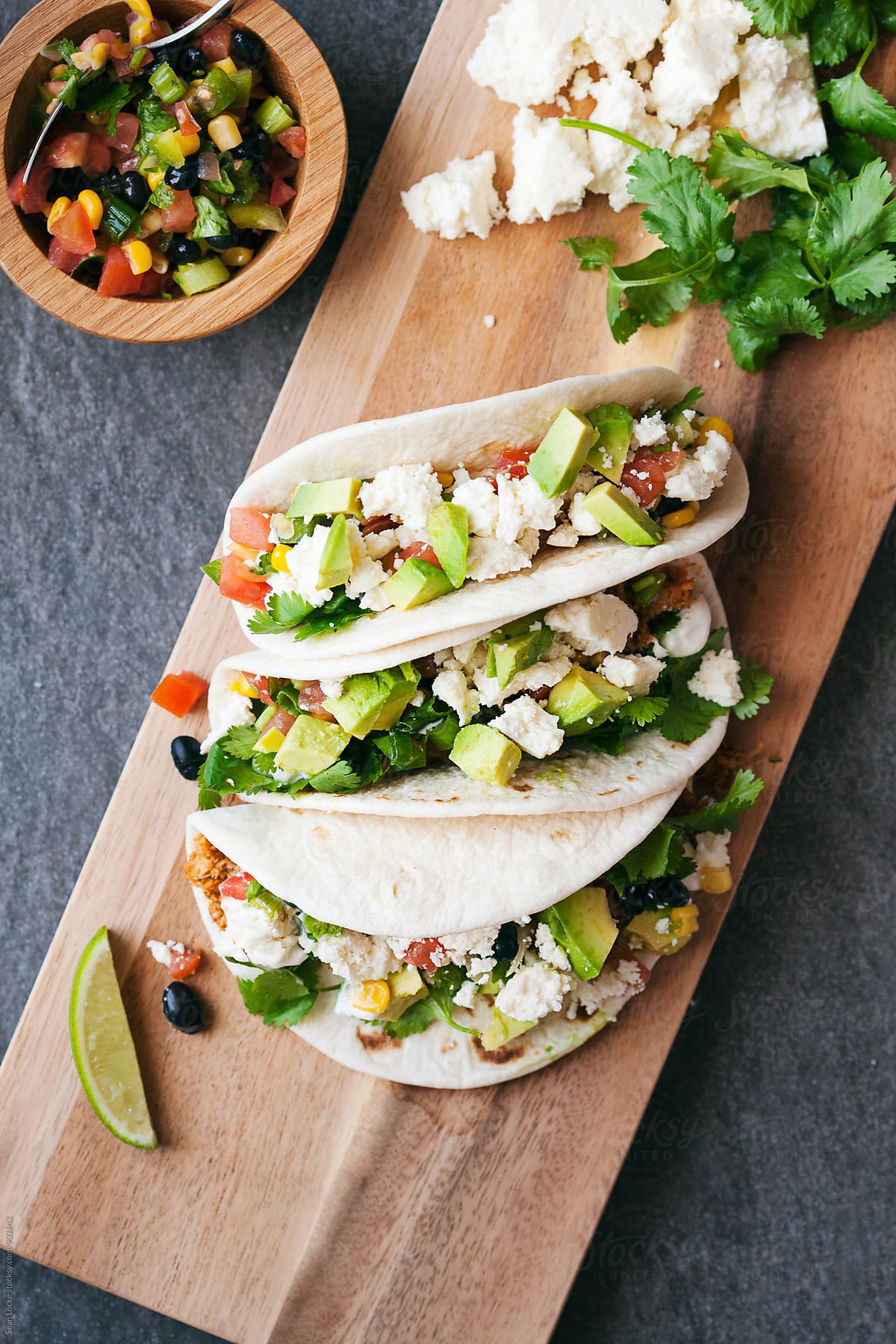 Tacos: Cutting Board With Three Chicken Soft Tacos