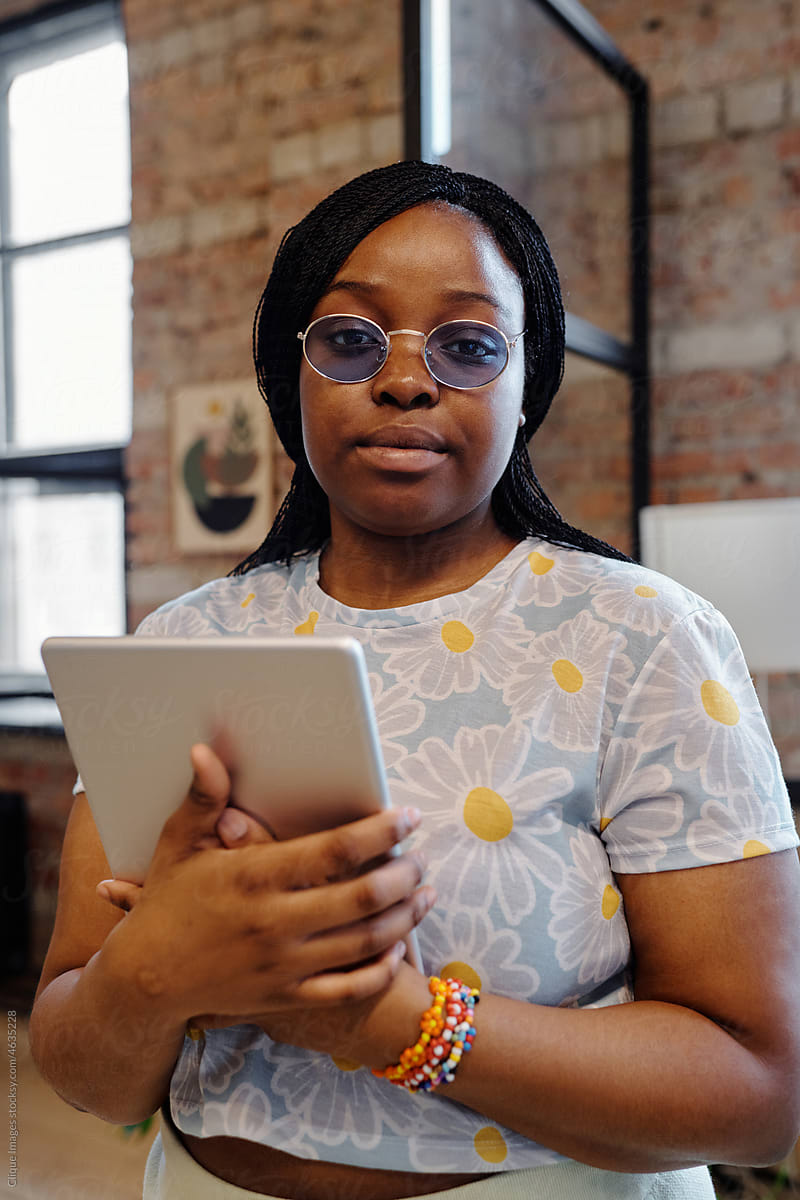 Young Black Woman With Digital Tablet