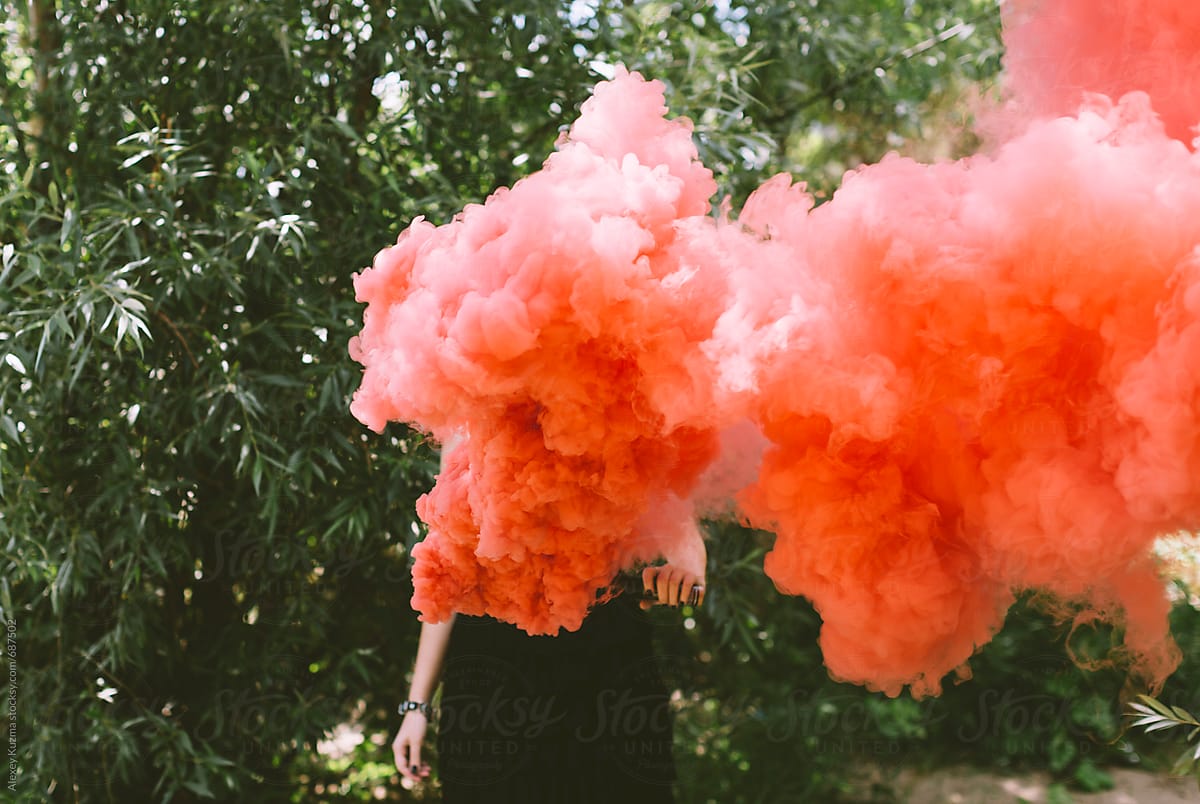 Woman  with red smoke bomb