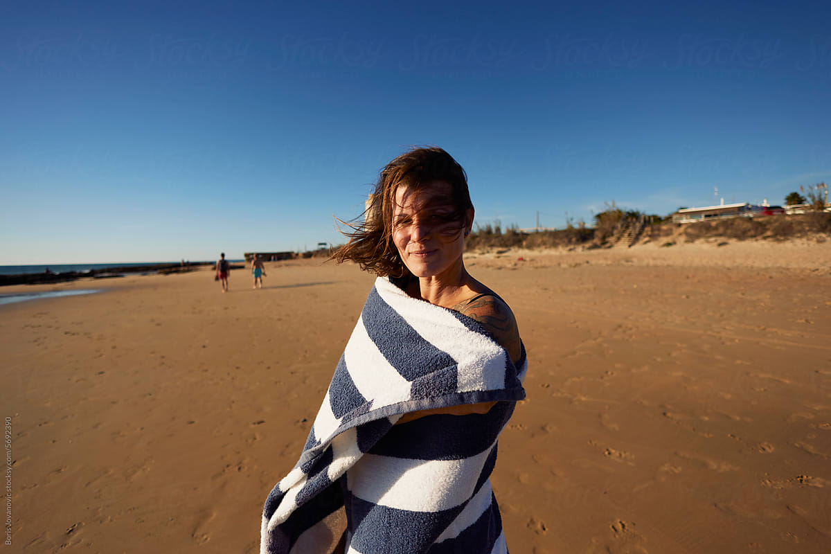 Towel-wrapped woman on the beach