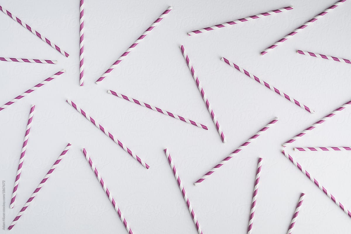 Colorful paper straws on white background