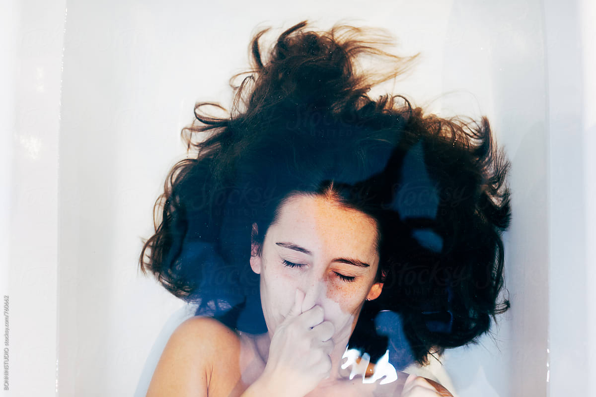 Woman Holding Breath Underwater In The Bathtub By Stocksy 