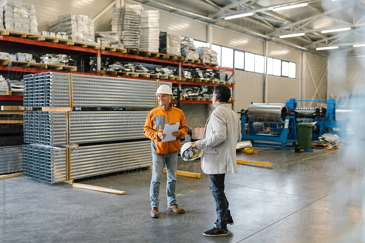 Manager With A Worker In A Warehouse