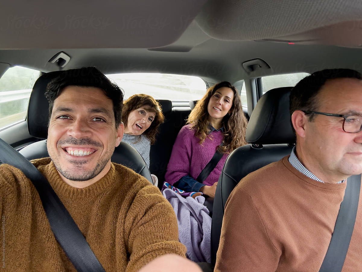 Selfie of a family traveling by car