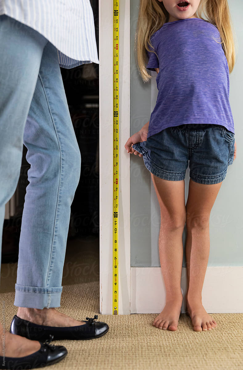 Girl Measuring her height
