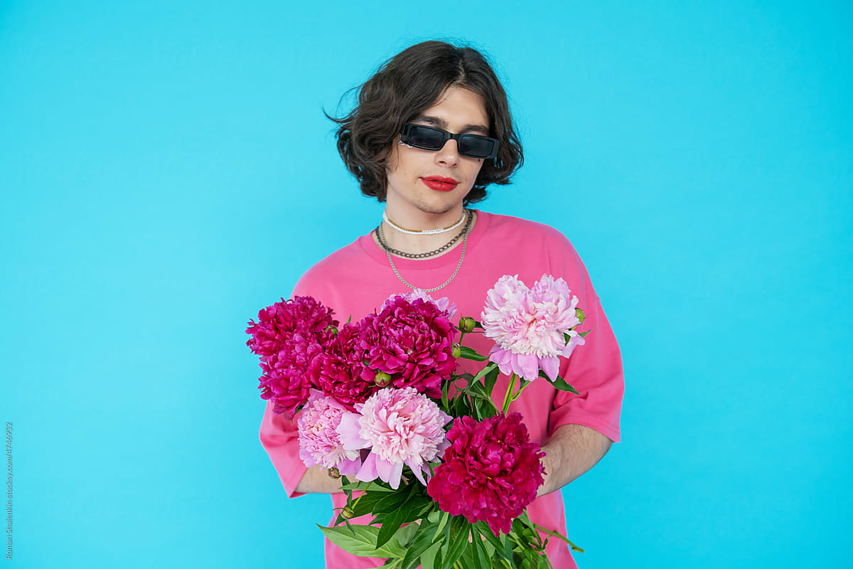 Non-Binary Man With Makeup On and Flowers