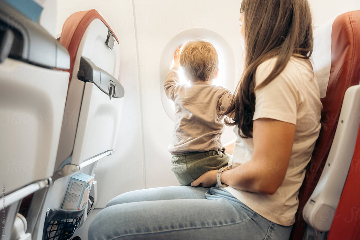 Mother and child traveling by plane