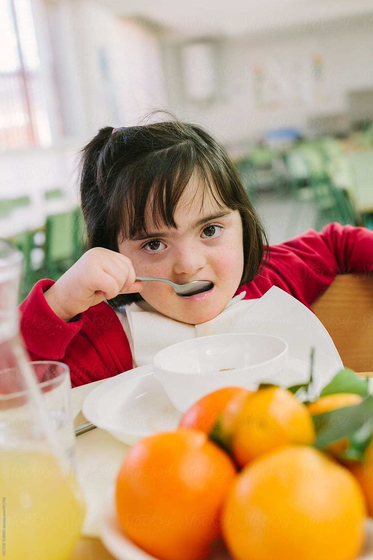 Kindergarten Kids Eating At School Canteen by Stocksy Contributor VICTOR  TORRES - Stocksy