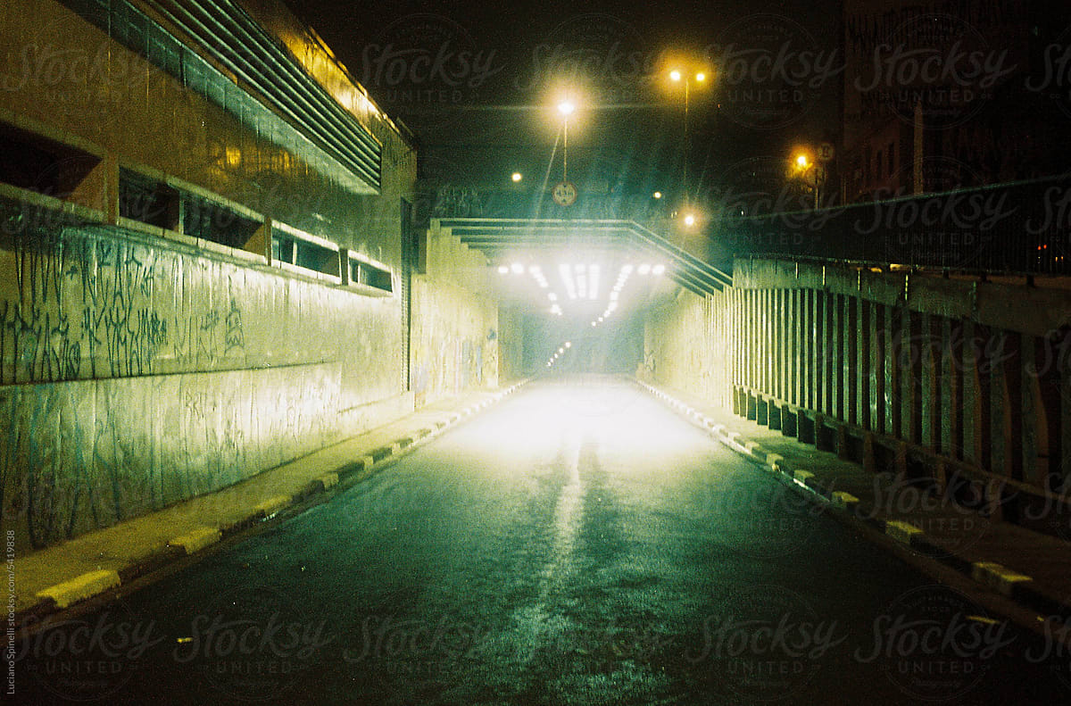View from the car: dark tunnel at night, scary urban scenario