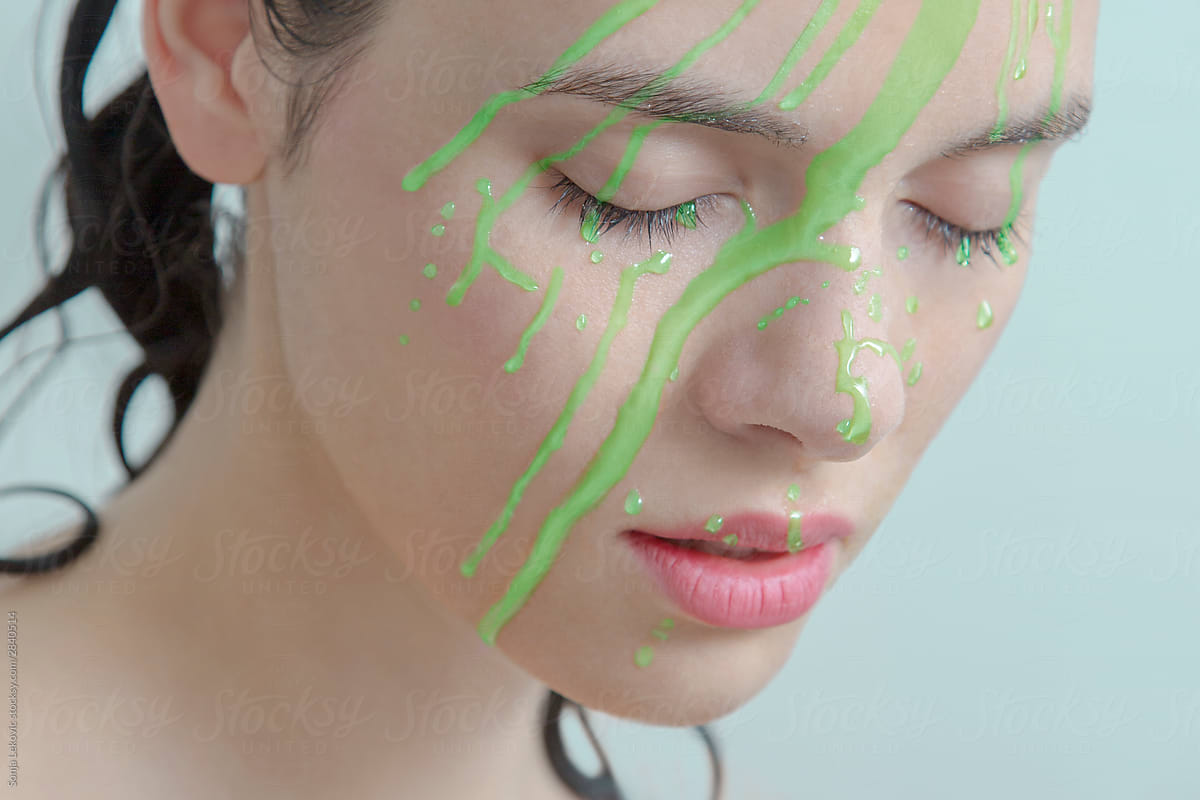 green liquid over beautiful face