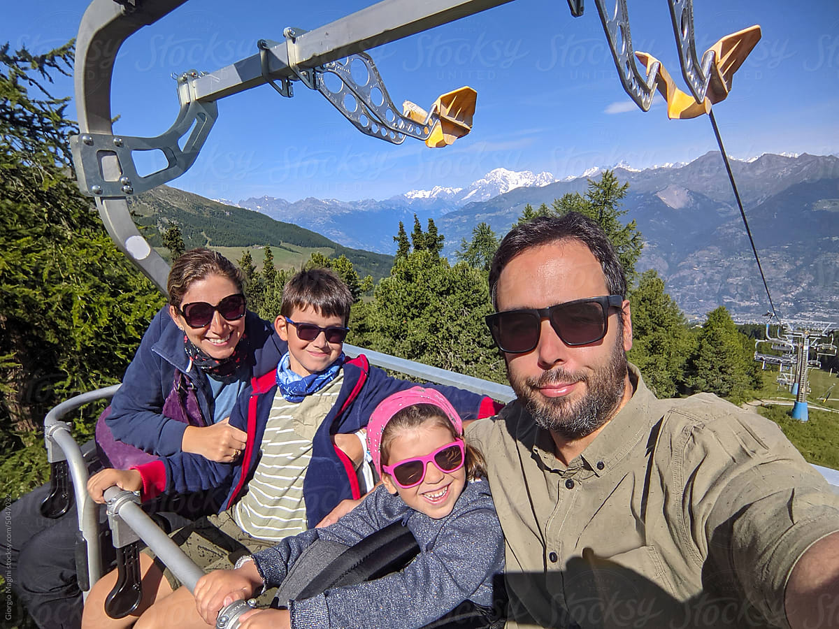 Family Selfie on a Chair Lift during Mountains Holidays