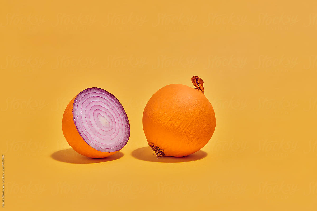 one and a half onions with orange painted peel