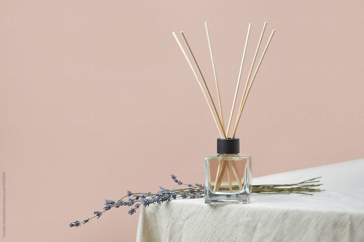 Aroma diffuser with lavender on linen tablecloth