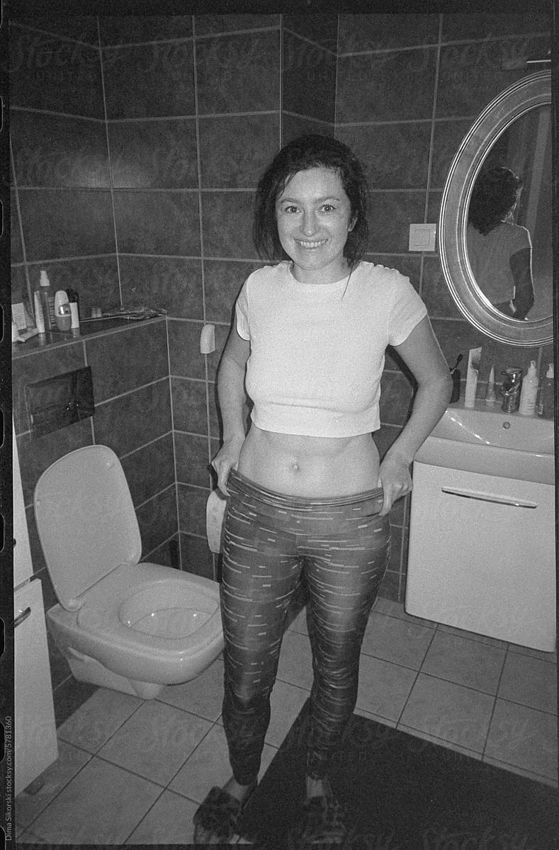 UGC film shot of a smiling girl in the toilet