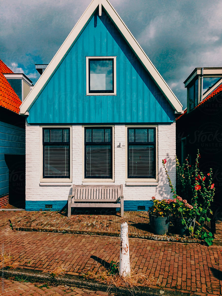"Blue Wooden House In Holland" by Stocksy Contributor "VISUALSPECTRUM" - Stocksy