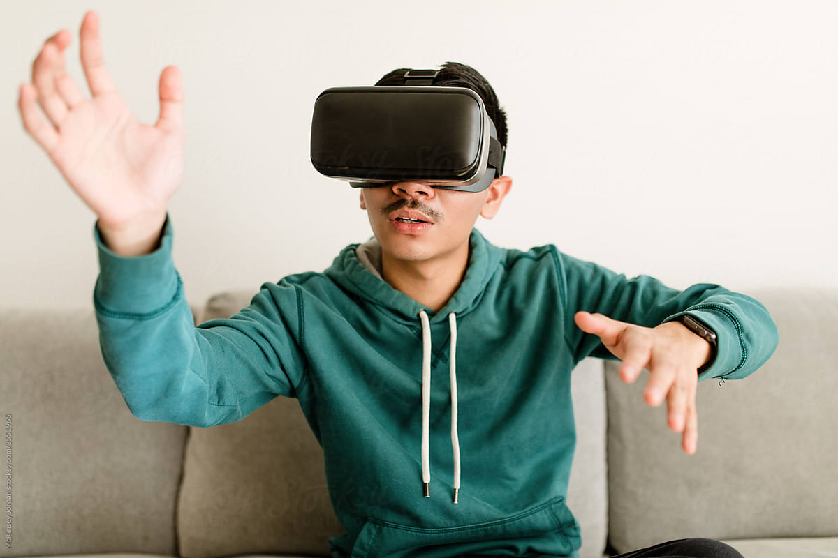 Asian Man Uses VR Headset