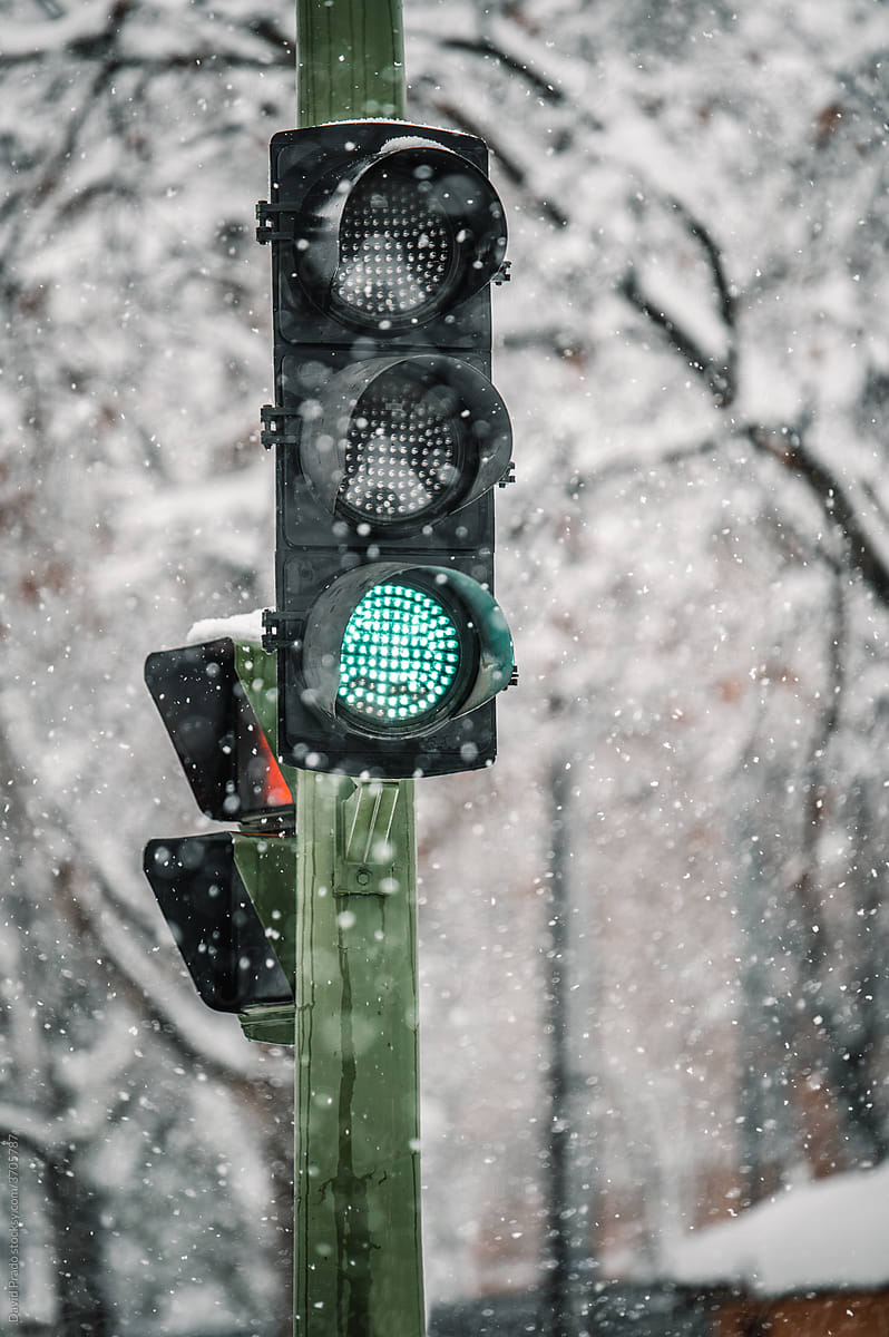 Traffic light glowing with green color