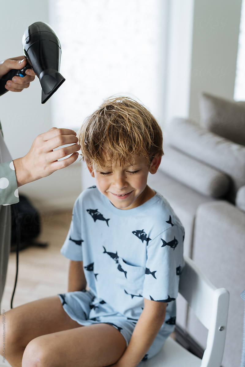Cute Boy Smiling During Hairstyling At Home By Stocksy Contributor Pietro Karras Stocksy 1512