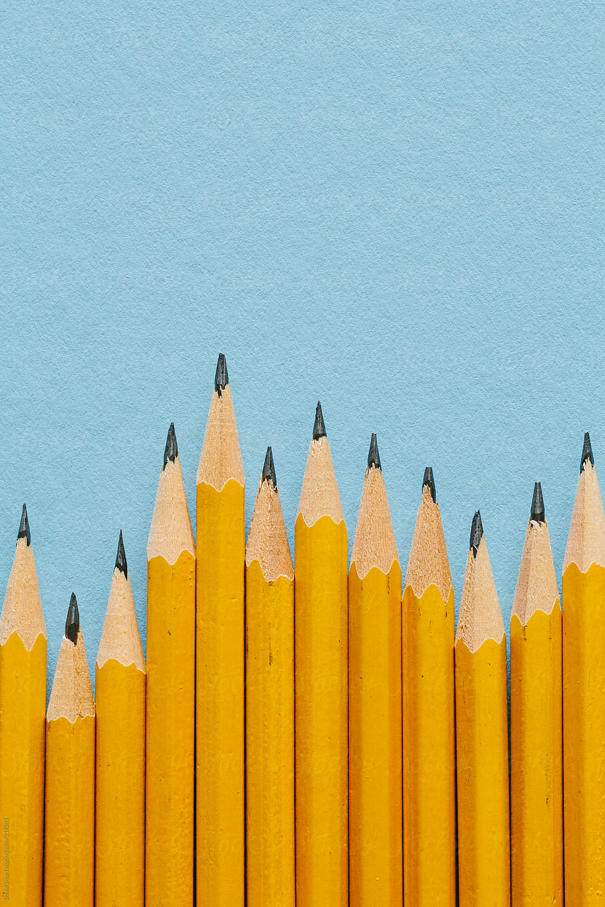 Yellow pencils used to represent bars in a graph
