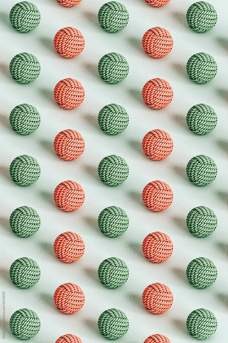 vertical isometric pattern of pink and green dog toy balls