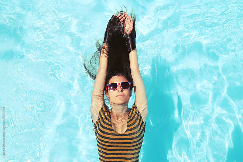 Long Haired Brunette In A Swimming Pool By Lucas Ottone Stocksy United