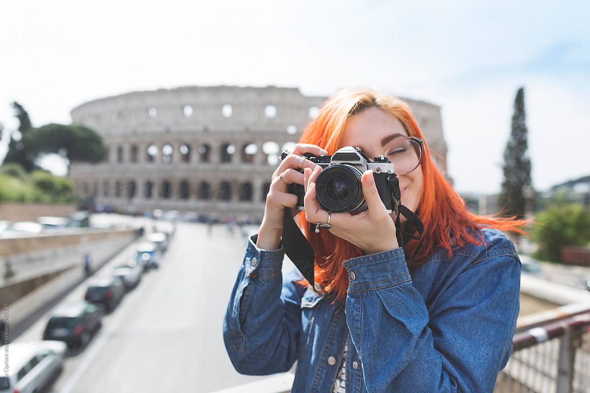 Young tourist taking pictures in Rome