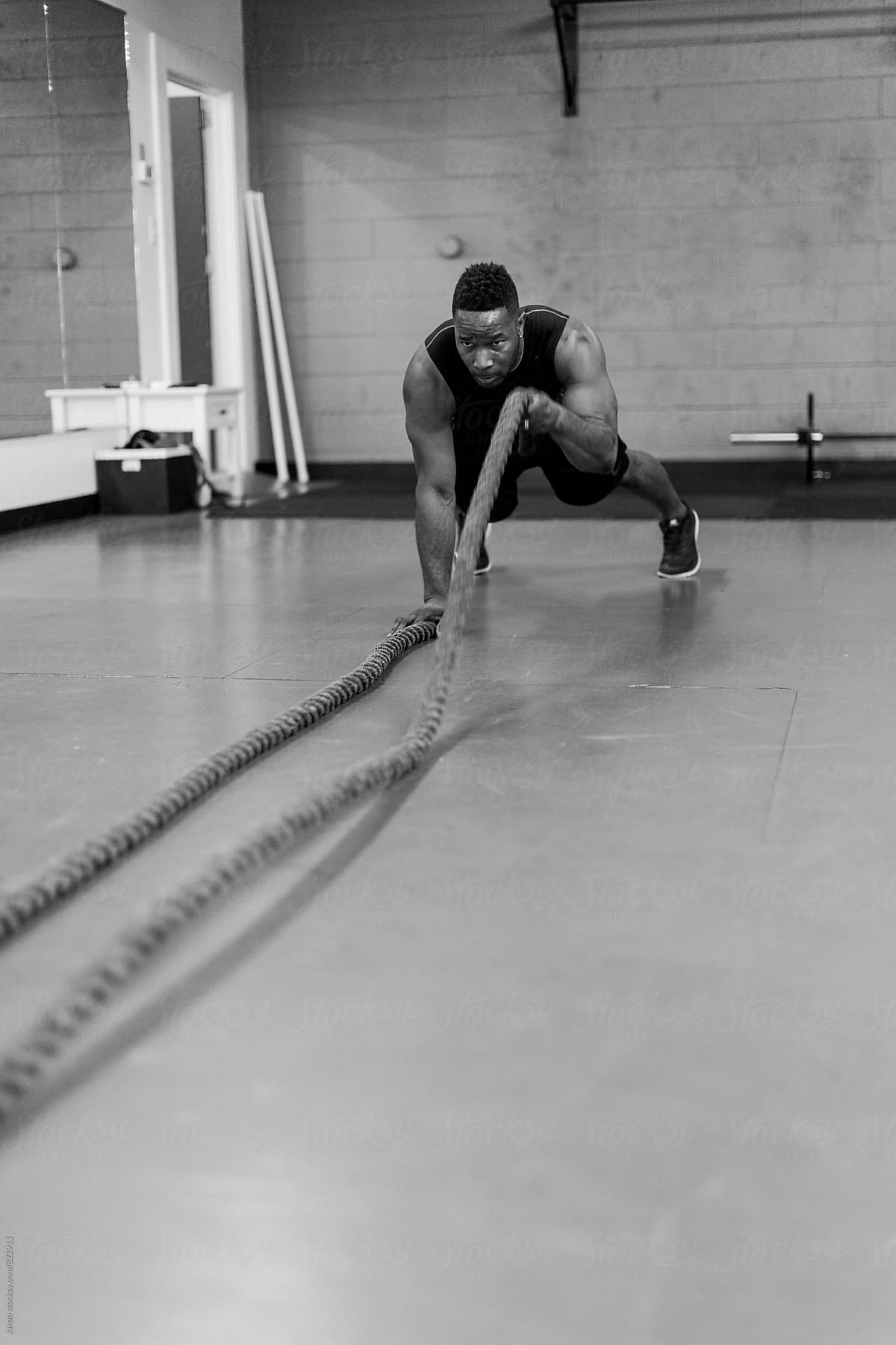 Fit And Muscular African American Athlete Working Out With Exercise