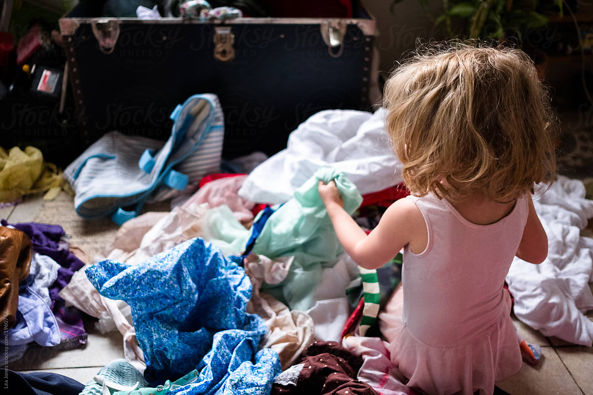Little Girl In Ballet Outfit Opening A Big Chest With A Lot Of Clothes. by  Stocksy Contributor Lea Jones - Stocksy
