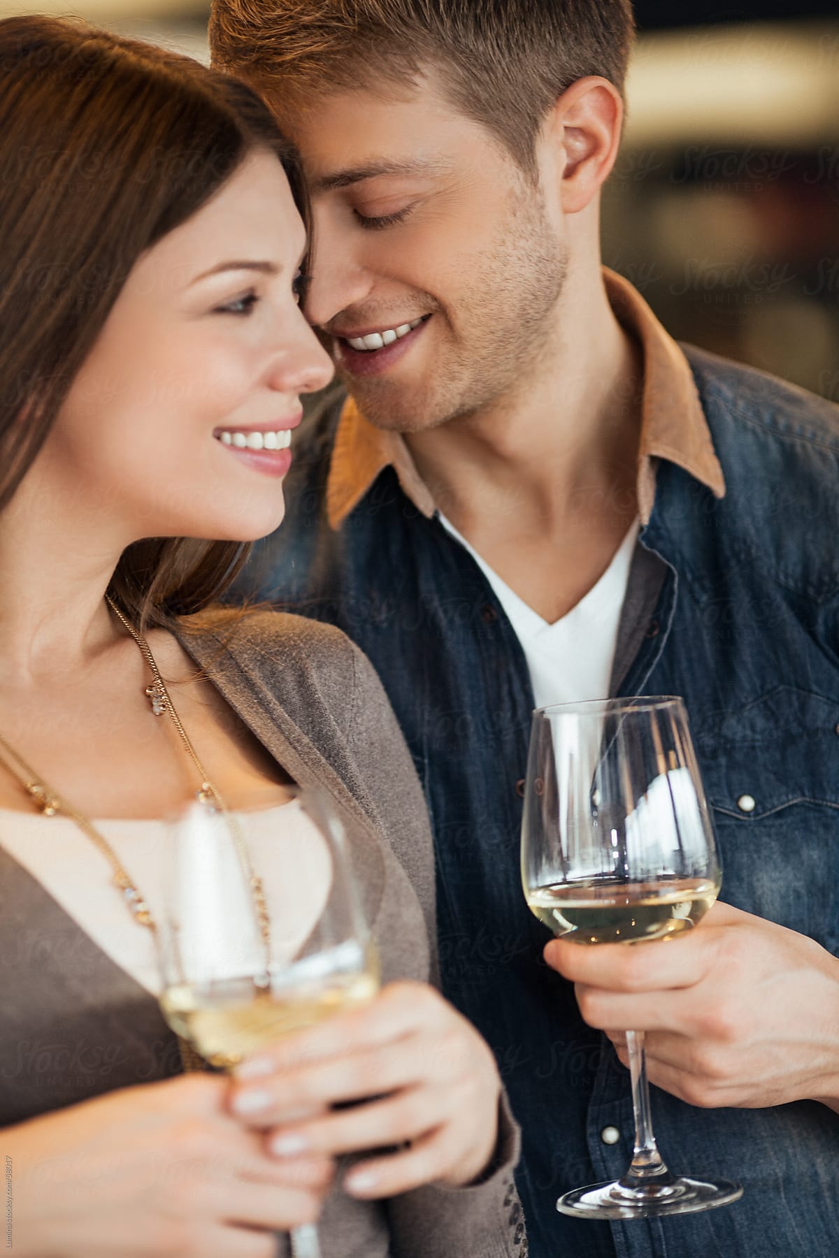 Couple Flirting At A Bar By Lumina Stocksy United